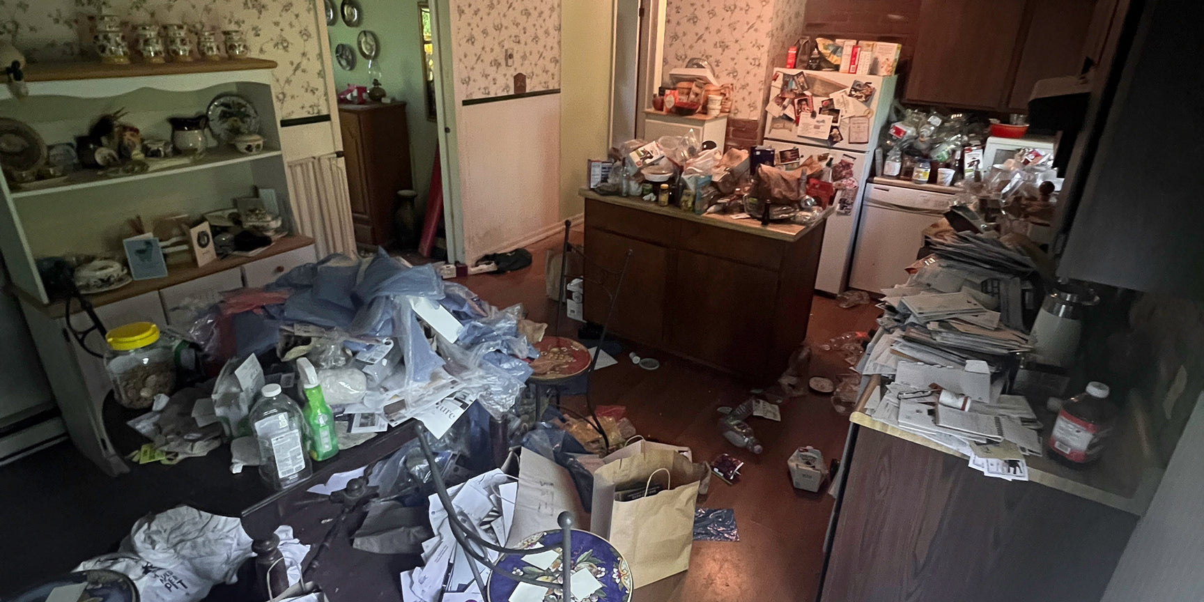 Displays the before image of a hoarders kitchen ready for a full service cleanout in Pinellas County, FL.