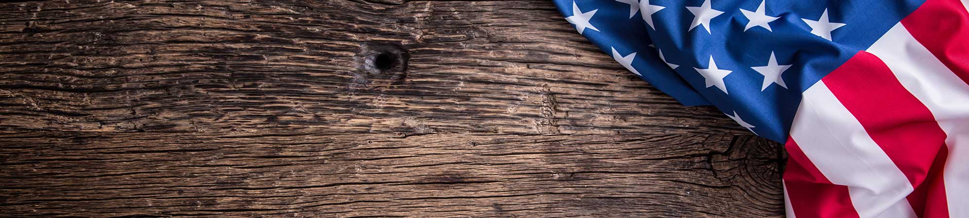 American Flag Draped Over Wood - Suncoast Dumpster Rentals